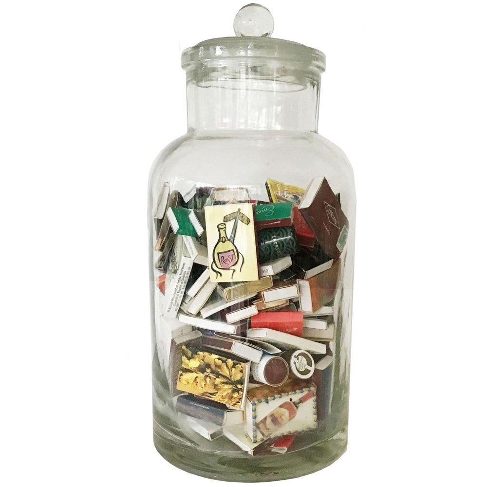 Vintage Depression Glass Apothecary Jar with Empty Matchboxes from my travels.